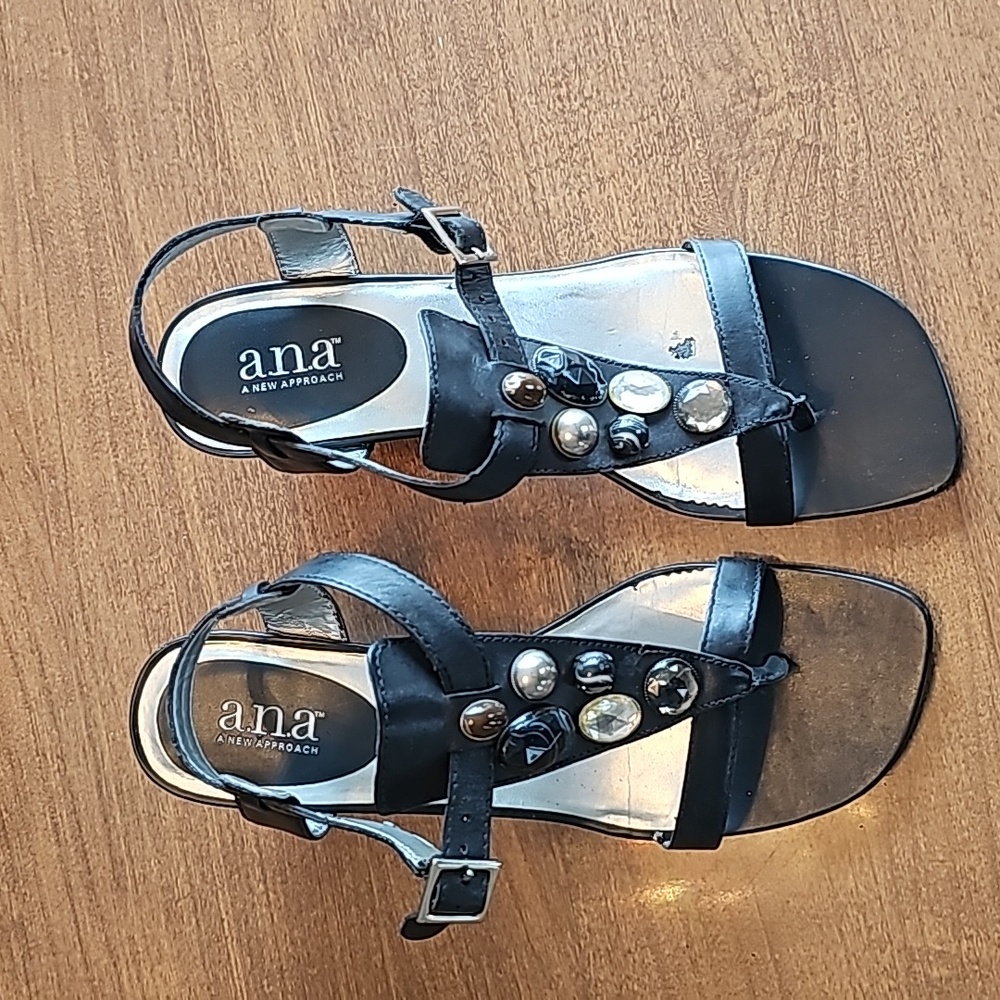 This is a pair of strappy black a.n.a rhinestone Gypsy heeled sandals size 8 1/2